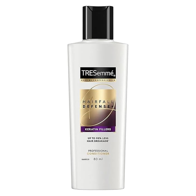 TRESemme Hair Fall Defense Conditioner, Fresh, 80 Ml, 1 Count. A white bottle with a black cap featuring the TRESemme logo and 'Hair Fall Defense' branding. Enriched with keratin to reinforce hair strength, reduce breakage, and promote longer, stronger hair.