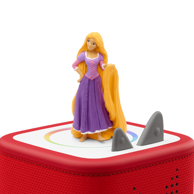 Tonies - FRENCH - Disney Princesse Raiponce figurine on a red Toniebox speaker, featuring Rapunzel in a purple dress with long yellow hair draped to the side, designed for screen-free educational play for kids ages 3 and up.