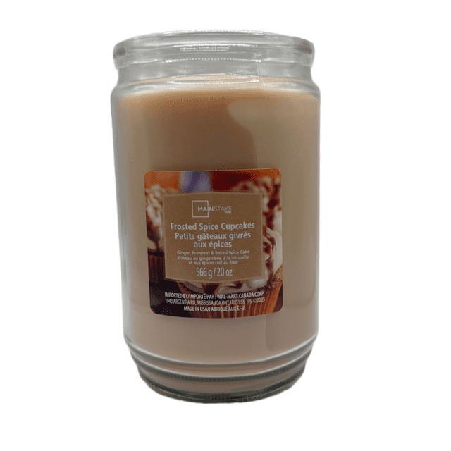 MAINSTAYS PL Frosted Spice Cupcake Scented Single-Wick Glass Jar Candle, 20 oz, beige paraffin wax in a clear glass jar with a label showing frosted spice cupcakes and scent notes of ginger, pumpkin, and baked spice cake, ideal for adding seasonal fragrance to home décor and creating a cozy atmosphere.