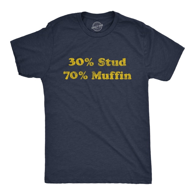 Mens 30% Stud 70% Muffin T Shirt Funny Dating Relationship Graphic Novelty Tee in Heather Navy, size L. This short-sleeve t-shirt features a humorous yellow text design on the front, reading '30% Stud 70% Muffin,' printed on a soft cotton blend fabric. Designed and printed in the USA by Crazy Dog T-Shirts, this slim-fit tee is machine washable and ideal for casual wear or as a gift for dads, boyfriends, or husbands.
