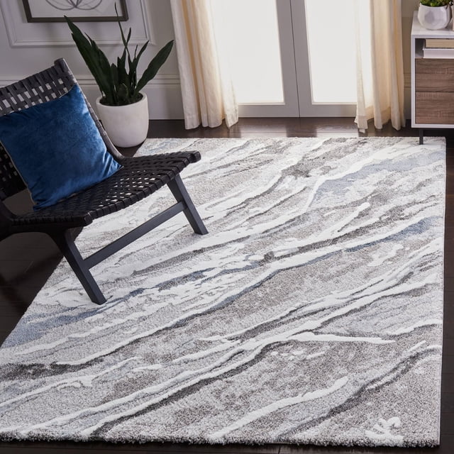 SAFAVIEH Century Elvina Contemporary Abstract Area Rug in a bright room with dark hardwood floors, featuring a power-loomed synthetic yarn design with abstract grey, white, and blue patterns. Positioned near a black woven chair with a blue cushion and a white planter, this durable accent rug suits modern home décor and adds texture and comfort.