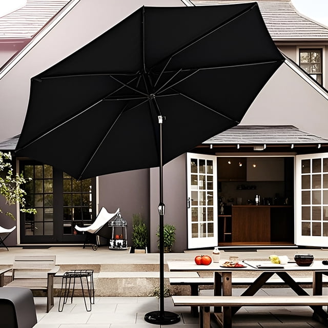 9ft Outdoor Round Patio Umbrella with a black polyester canopy and black powder-coated steel frame, featuring 8 sturdy ribs for enhanced support. The umbrella includes a crank open system and push-button tilt for adjustable shading. Shown in a backyard setting with a patio table and chairs, the umbrella provides UV and weather protection. Note: The base is not included and must be purchased separately.