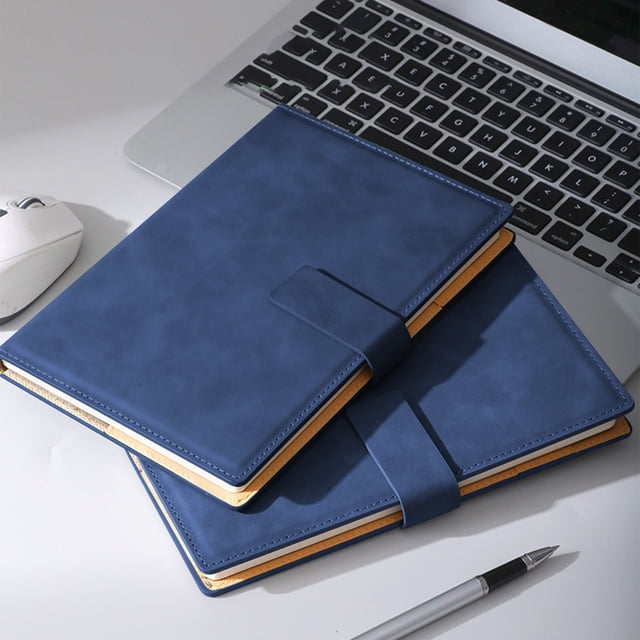 EGNMCR Magnetic Closure Notebook in dark blue, featuring a sleek design with a secure magnetic closure. The notebook measures 21.7x14.8cm (8.54x5.83in) and is ideal for business, office work, and conferences. Displayed on a desk alongside a laptop, mouse, and pen, showcasing its professional use.