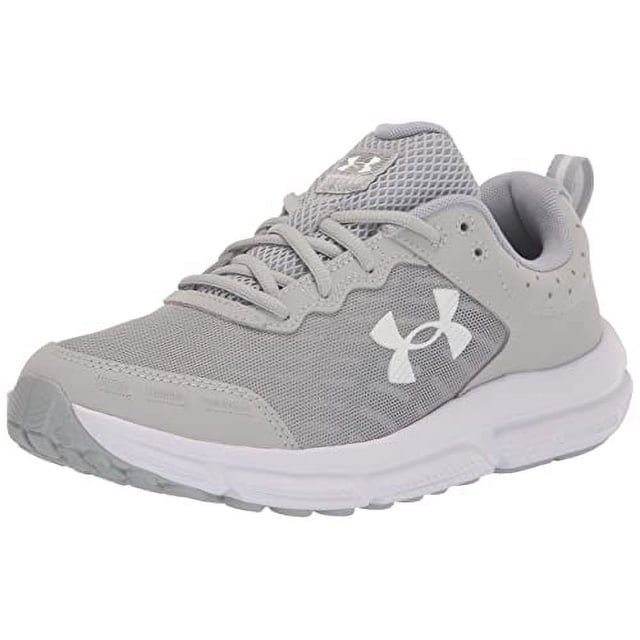 Under Armour Chaussure de Course pour Homme Charged Assert 10 en Gris Mod/blanc, Taille 9. Dotée d'Une Empeigne en Maille Légère et Respirante avec des Superpositionss Synthétiques pour la Durabilité et le Soutien. Comprend une Doublure en EVA pour le Confort, une Semelle Intercalaire Amortissante Chargée pour la Réactivité, et une Semelle Extérieure en Caoutchouc Solide pour la Durabilité. Conçue pour les Coureurs Neutres avec un Décalage de 10 mm.
