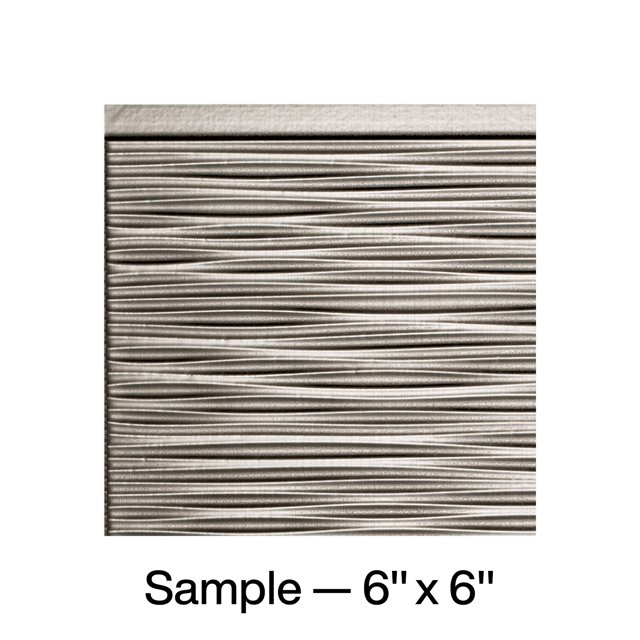 FASÄDE Ripple Decorative Vinyl Backsplash Panel in Brushed Nickel, displayed as a 6x6 inch sample. The panel showcases a textured ripple design with a brushed metallic finish, suitable for DIY home improvement projects like kitchen backsplashes, accent walls, or office decor.