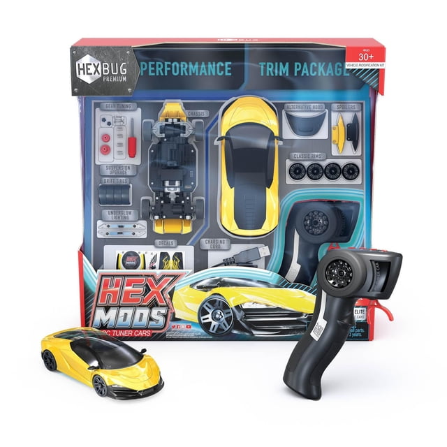 HEXMODS Pro Series Elite customizable RC tuner car set with yellow exotic supercar body, black chassis, gear tuning parts, suspension and tire upgrades, decals, alternative hood, spoilers, classic rims, LED underglow lighting, and 2.4 GHz remote control for precise steering.