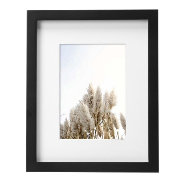 hometrends Gallery Black Picture Frame with a black border and white mat holding a 5x7 photo of beige pampas grass against a bright sky, suitable for wall or tabletop display, ideal for home décor and personalized gifts.