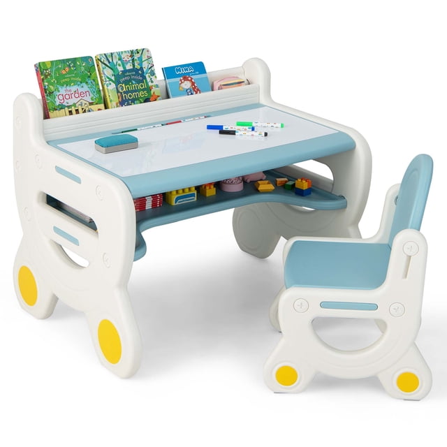 Costway Kids Drawing Table & Chair Set in blue and white, featuring an erasable graffiti tabletop with included markers and eraser. The set includes a table with built-in storage shelves for books, toys, and stationery, and a matching ergonomic chair with a rounded backrest. The table has a trapezoid structure with non-slip foot pads for stability and safety. Suitable for children aged 3-8 years, this set is ideal for drawing, learning, playing, and eating. The chair can be tucked under the table for space-saving storage.