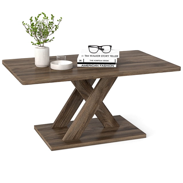 Costway Table Basse de 37,5 Pouces avec Base Stable et Raccord en Bois de Caoutchouc pour Salon. Cette Table Basse Rectangulaire Présente une Finition Brun Rustique avec une structure de support Géométrique en Forme de x en Contreplaqué de Bois de Caoutchouc et des Connecteurs en Bois de Caoutchouc Massif. le Plateau Spacieux Mesure 37,5 Pouces x 23 Pouces et Est Idéal pour Tenir des Livres, de la Déco Ou des Boissons. la Base Grand avec Patins Antidérapants Assure la Stabilité et la protection du Plancher. Convient aux Salons, Chambres Ou Bureaux, Elle Allie Élégance Moderne et Charme Rustique