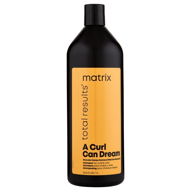 Matrix A Curl Can Dream Shampoo 1 Liter bottle with a black container and yellow label featuring product details. Perfect for wash day, designed for curls and coils, infused with Manuka honey extract for deep cleansing and curl pattern preservation.