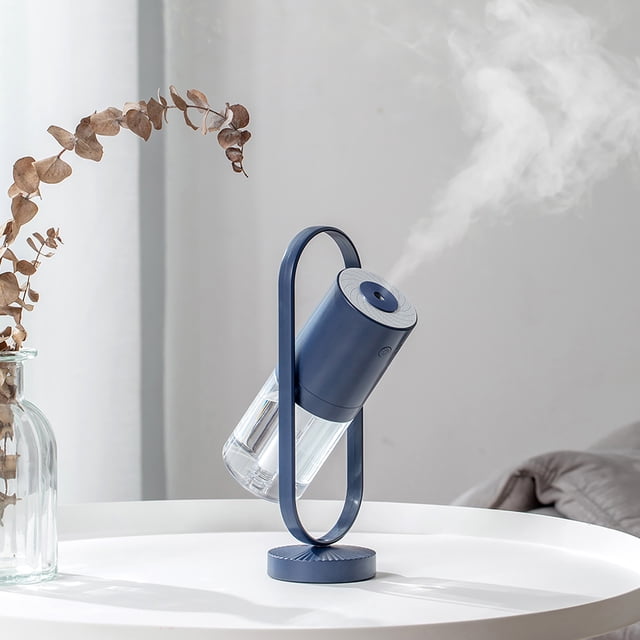 RKSTN Humidifiers for Bedroom Large Room Humidifier Desktop Humidifier Aroma Diffuser 360° Angle in a sleek sky blue design. This ultrasonic humidifier features a compact cup-shaped design on a modern stand, emitting cool mist. Suitable for bedrooms, nurseries, and plants, it offers adjustable spray direction, ultra-quiet operation, and LED lighting for ambiance.