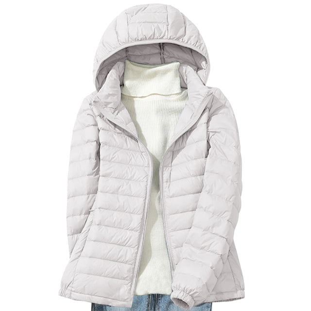 Lolmot Women's Down Jacket Lightweight Hooded Short Korean Style Extra Large Size Plus White Down Warm Jacket. A front-facing view of a white puffer jacket with a hood, featuring quilted stitching and a zip closure. The jacket is styled over a white turtleneck sweater and blue jeans, ideal for casual winter and spring wear. Lightweight and warm, suitable for layering during colder seasons.