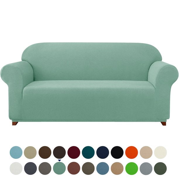 Subrtex Housse de Canapé Extensible 1 Pce Slipcover Antidérapante avec Motif à Carreaux Texturé de Couleur Vert Pâle. la Slipcover Est Conçue pour s'Adapter à Diverses Tailles de Sofa avec Coins Élastiques Intégrés pour un Ajustement Semi-Personnalisé. Faite de 85 % polyester et 15 % Élasthanne, Elle Est Douce, Agréable pour la Peau et durable. l'Image Montre la Slipcover sur un Sofa Trois Places avec Plusieurs options de Couleur Affichées Ci-Dessous.