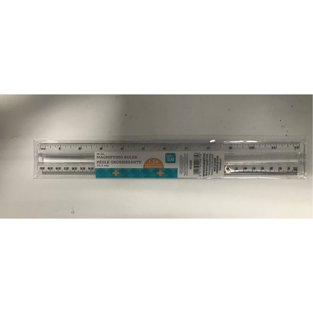 PG MAGNIFYING RULER, a 12-inch clear plastic measuring tool with black inch and centimeter markings and a 1.5x magnifying strip for enhanced reading accuracy, packaged in transparent plastic with bilingual English and French labeling, suitable for office and school use.