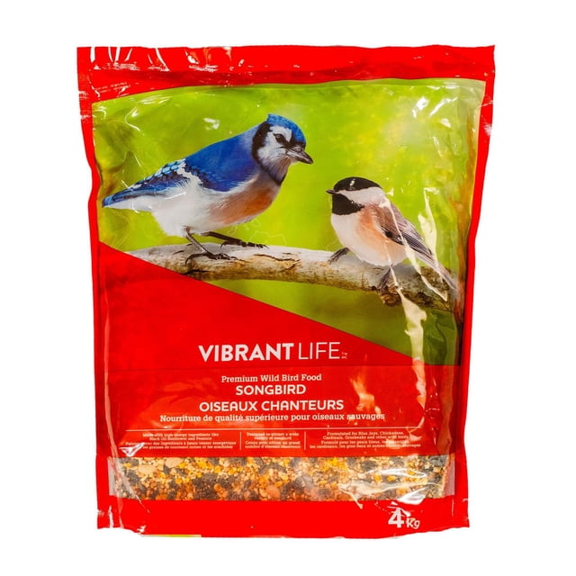 Vibrant Life Songbird Premium Wild Bird Food 4KG bag with red packaging featuring a blue jay and chickadee on a branch, containing a mix of high-energy seeds like black oil sunflower and peanuts, formulated to attract various wild songbirds including cardinals and grosbeaks, ideal for backyard bird feeding.