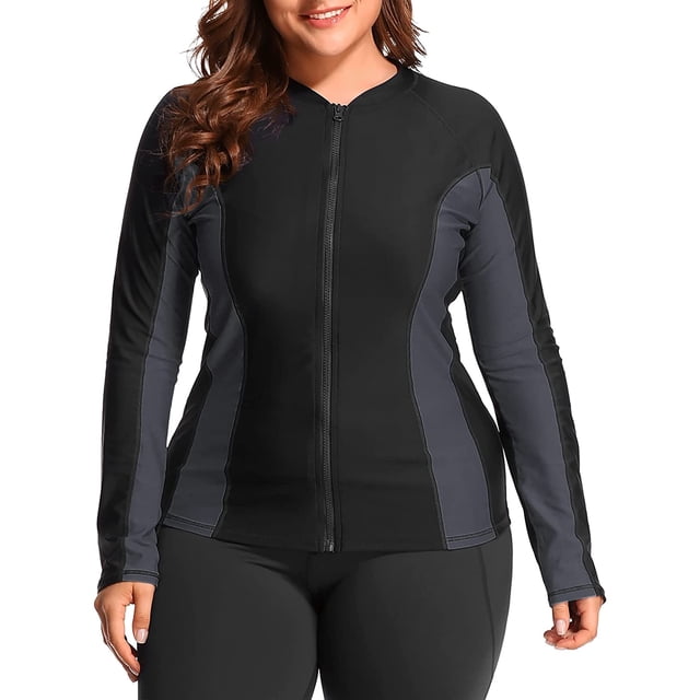 Charmo Womens Plus Size Long Sleeve Rash Guard Top Zipper Swimsuit Swim Shirt in black and grey. Designed for swimwear, it features a front zipper for easy wear, long sleeves for UV protection (UPF 50+), and side splicing for a stylish look. Made of 82% nylon and 18% spandex, offering elasticity, quick-drying comfort, and protection against rashes.
