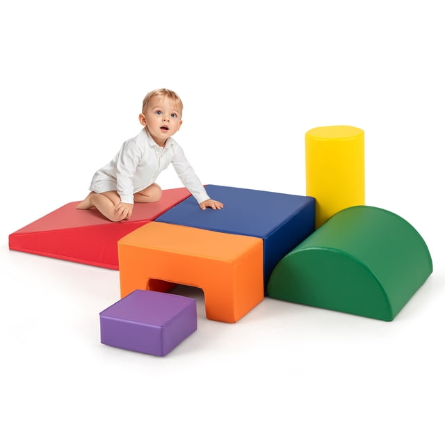 Gymax 6 PCS Kids Climber Play Set Indoor Foam Climb & Crawl Activity Blocks w/ Cover. The set includes six multicoloured foam blocks in various shapes: large rectangle, wedge, cylinder, half-moon, concave, and small rectangle. A toddler is shown playing on the blocks, which are designed to promote physical skills, creativity, and safe play. The blocks feature rounded corners, a zippered cover for easy cleaning, and a soft, skin-friendly material.