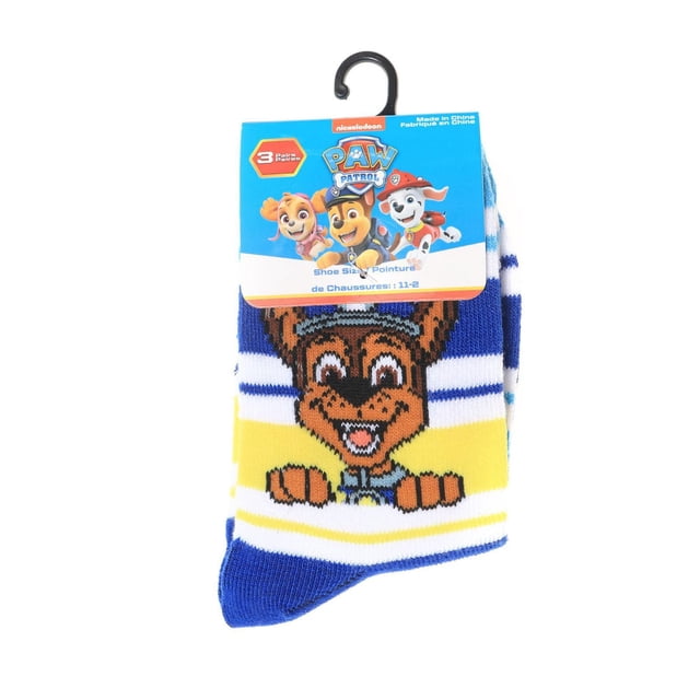 Paw Patrol 3 Pack Low Cut Socks featuring a folded pair with a knitted design of a smiling Paw Patrol character on blue, white, and yellow stripes, attached to a blue branded cardboard hanger with shoe size 11-2, ideal for boys' everyday wear and casual comfort.