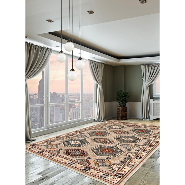 ECARPET Qashqai Taupe Rug featuring Persian tribal patterns in taupe, navy, rust, and cream hues on a wooden floor in a modern room with large windows showing a city skyline, light grey curtains, and a potted plant. Often used to add charm and refinement to indoor living spaces.
