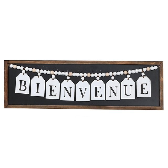 IH Casa Decor Framed Wood Hanging Beaded Bienvenue Sign with white tag-shaped letters spelling 'Bienvenue' on a string of alternating white and natural wood beads, mounted on a black background inside a light brown wooden frame, measuring 24 by 7.25 inches, suitable for welcoming wall décor.