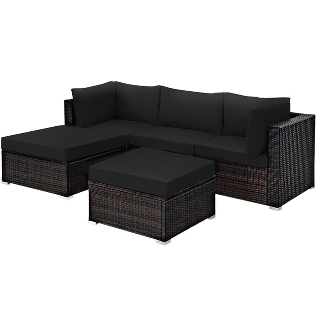 Patiojoy 5-Piece Outdoor Patio Sectional Rattan Sofa Set with Soft Back and Seat Cushion Black. This set includes two corner sofas, one armless sofa, one ottoman, and a coffee table with a tempered glass top. The black cushions are thick and comfortable, with removable covers for easy maintenance. The rattan construction is weather-resistant and features a dark brown woven design. Suitable for patios, gardens, or porches, this set offers versatile seating arrangements and durability for outdoor use.