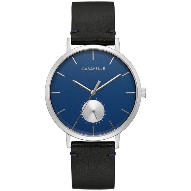 Caravelle Mens Silver-Tone Quartz Watch with 39.5mm stainless steel case, blue dial with silver-tone hands and hour markers, 24-hour sub dial at six o’clock, black leather strap with contrast blue stitching, three-piece wire closure, and 30m water resistance, ideal for everyday use.