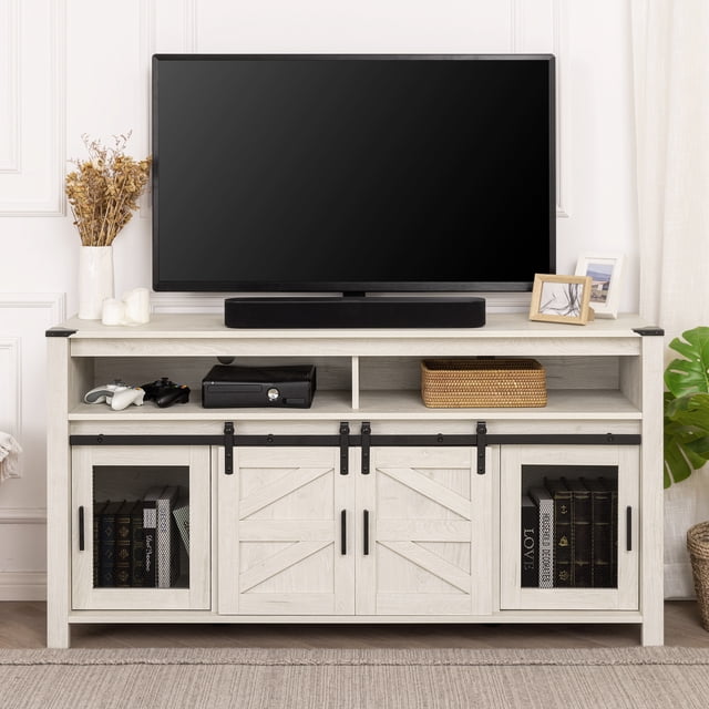 WAMPAT Farmhouse TV Stand in antique white, compatible with 65-inch TVs. Features sliding barn doors, mesh side doors, and a rustic farmhouse design. Includes two open compartments, two side cabinets, and a three-level adjustable shelf for storage. Made from engineered wood with metal accents, it offers cable management holes and anti-tip kits for safety. Displayed in a living room setting with a TV, soundbar, and decorative items.