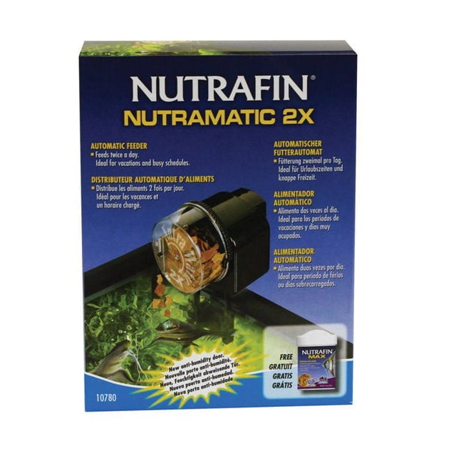 Nutrafin Nutramatic 2X Automatic Fish Food Dispenser Feeder packaging showing the feeder mounted on an aquarium rim dispensing flakes, with features including twice daily adjustable feeding portions, an anti-humidity door to keep food fresh, compatibility with flakes, pellets, and granules, and a free Nutrafin Max fish food sample included.