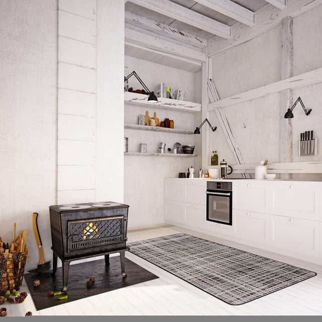 ECARPET Kitchen, Hallway, Laundry Room, Entrance, Kids Room, Bathroom Mat & Utility Rug, Non Slip Rubber Backing displayed in a bright rustic kitchen with white wood floors and walls, featuring a black and white geometric runner rug placed in front of white cabinetry with built-in oven, open shelves with kitchenware, and a black cast iron wood stove on a black hearth mat surrounded by firewood and pinecones, ideal for high traffic areas and easy to maintain.