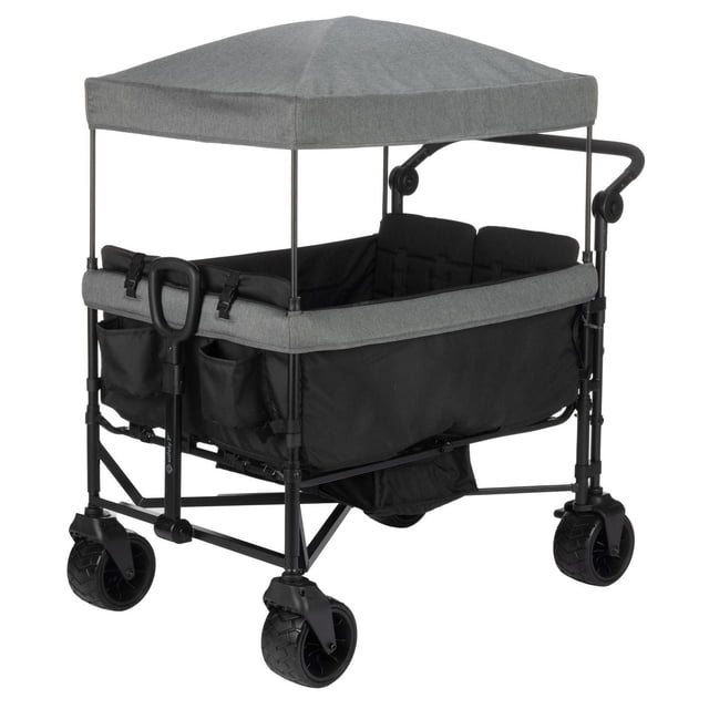 Safety 1st Summit Quad Wagon Stroller with grey adjustable canopy and padded black seats for up to four children, featuring individual fold-down seats, all-terrain wheels, front pull handle, rear fold-away push handle, and multiple storage pockets including a fold-away basket.