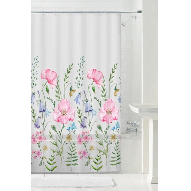 Mainstays Recycled PEVA Decorative Shower Curtain, waterproof and medium weight, with a white background and multicolour floral pattern of pink, blue, and yellow flowers with green leaves, hanging in a white tiled bathroom with a bathtub and chrome showerhead.