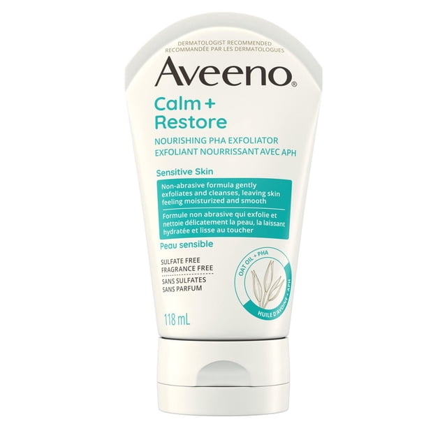 Aveeno Calm + Restore Nourishing PHA Exfoliator in a 118 mL white squeeze tube with teal and black text, designed for sensitive skin, featuring a non-abrasive formula with hydrating polyhydroxy acid and oat oil, sulfate-free and fragrance-free face scrub that gently exfoliates and cleanses while respecting skin’s moisture barrier.