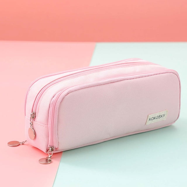 Boovnll Pencil Pouch, Japanese and Korean style multi-layer cloth pencil case with a soft pink exterior, featuring dual zippered compartments for organized storage of stationery items like pencils, erasers, and small accessories. Made from durable, environmentally friendly cloth material, it is compact yet spacious, suitable for students, literary youth, or as a travel accessory for storing small items like cards or notes. The pouch is displayed against a pastel pink and mint green background.