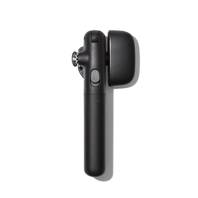 OXO SW Snaplock Can Opener, 7.5-inch black manual kitchen utensil with stainless steel cutting wheel, snap-lock mechanism to hold can securely, contoured turning knob, and soft non-slip handles, shown side profile on white background.