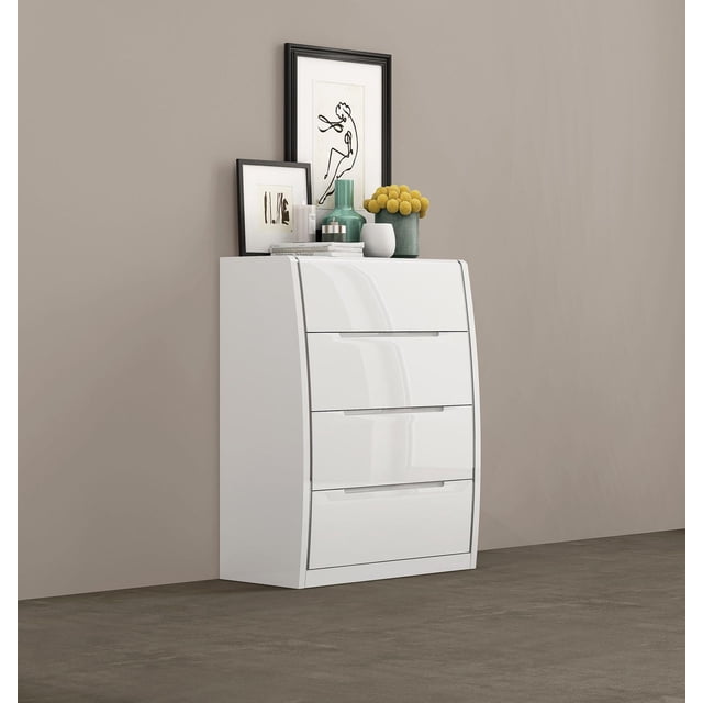 K-Living Phoebe 4-Drawer Solid Wood Chest in White Lacquer Finish with a glossy curved silhouette and four handle-less drawers, placed against a beige wall and gray floor. The chest is topped with two framed abstract artworks, a green vase, a white pot with yellow billy ball flowers, and stacked books, making it ideal for modern bedroom or home office storage.