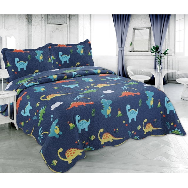 Marina Decoration Rich Printed Stitching Coverlet Bedspread Ultra Soft Summer Bedding Quilt Set with Quilted Sham in twin size, featuring colorful dinosaur patterns including Stegosaur and T-Rex on a navy blue background, made of 100% polyester with durable, wrinkle-free, and fade-resistant fabric, displayed on a bed in a bright kids' room with white walls and blue curtains.
