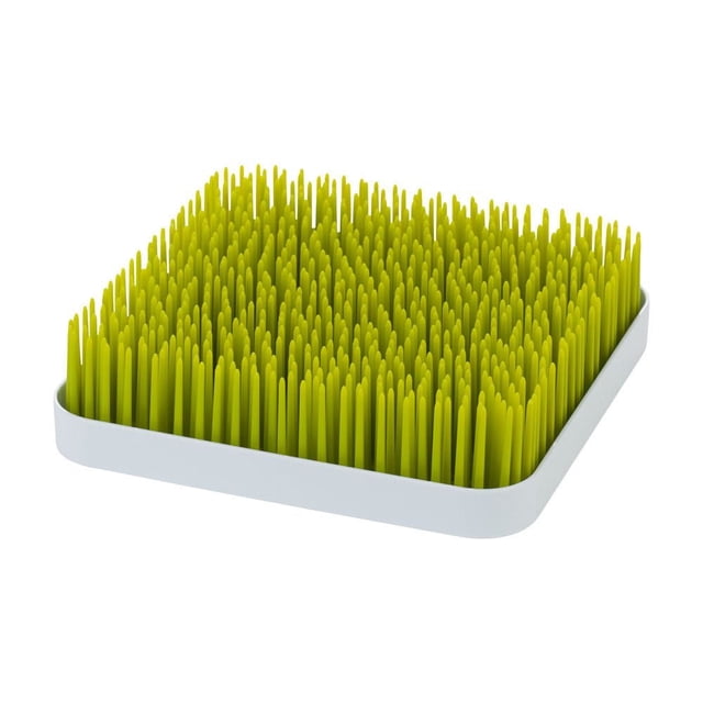Boon Support de Séchage en Herbe avec base Blanche à Profil Bas et Lames Vertes Flexibles Ressemblant à de l'Herbe, Conçu pour Sécher à l'Air les Biberons et Accessoires Verticalement sur un Comptoir pendant Que l'Eau s'Accumule dans le Plateau Inférieur.