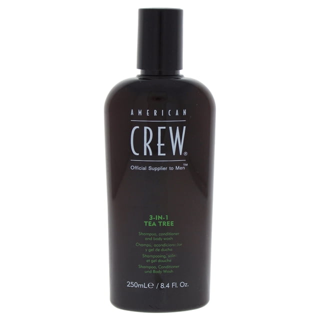 3-In-1 Tea Tree Shampoo & Conditioner & Body Wash by American Crew for Men in an 8.4 oz bottle. The dark bottle displays the American Crew logo and product details in white and green text. Ideal for travel, gym, or daily use, it cleanses hair and skin, leaving them soft, shiny, and refreshed with a natural antiseptic tea tree scent. Suitable for travel size toiletries kits.