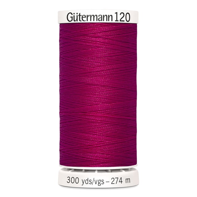 Gutermann 120 100% polyester all purpose thread spool in magenta, tightly wound on a white plastic spool labeled with brand and 300 yards (274 meters) length, suitable for machine and hand sewing woven, knit, and synthetic fabrics, also ideal for craft and mending projects.
