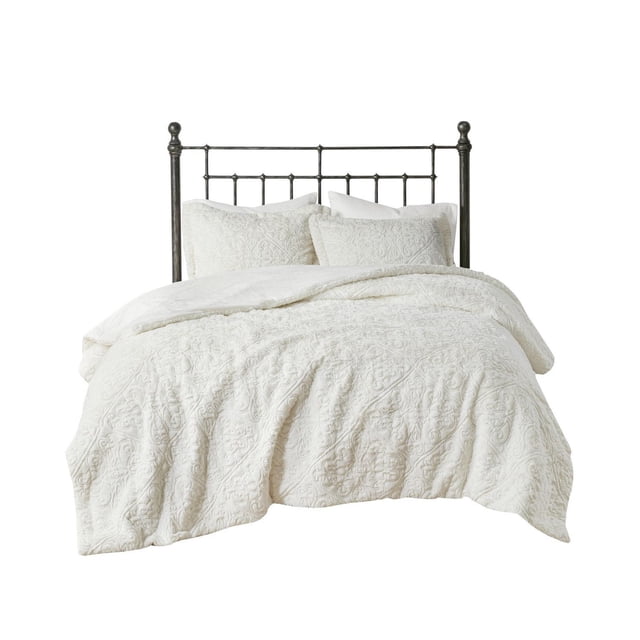 Home Essence Syracuse Comforter Set on a dark metal bed frame, featuring a plush white comforter and two matching shams with a textured medallion design, providing warmth and softness. This bedding set is machine washable and suitable for enhancing bedroom comfort.