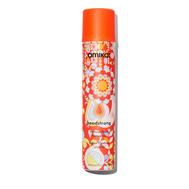 Amika headstrong intense hold hairspray in a vibrant orange and floral-patterned aerosol can. This freeze-hold, fast-drying finishing spray provides strong hold and is suitable for color-treated, Brazilian-treated, and keratin-treated hair. Enriched with provitamin B5 for resilience and conditioning.