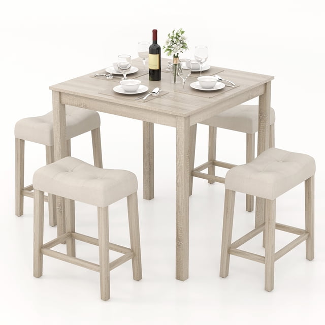 Gymax 5 PCS Square Bar Table Set for 4 with padded stools and rubber wood legs, featuring a compact square table and four tufted stools in grey fabric upholstery. The table has a spacious MDF tabletop and stools with built-in footrests, offering a space-saving design ideal for kitchens, breakfast nooks, or small dining areas.