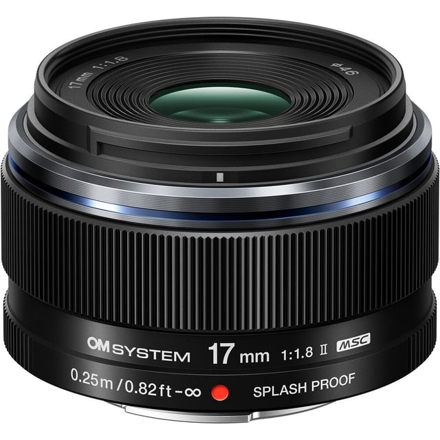 OM SYSTEM M.Zuiko Digital 17mm f/1.8 II Lens shown in a close-up front view, featuring a compact black wide-angle prime lens with textured focus ring, engraved white markings for 17mm focal length, f/1.8 aperture, splash proof label, and MSC autofocus, designed for low-light and weather-sealed outdoor photography.