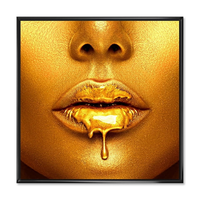Designart Gold Paint Drips From Sexy Woman Lips FLOAT FRAME WALL ART depicting a close-up of lips with gold paint dripping down, printed on premium fade-resistant cotton canvas stretched over a 1-inch wood sub frame with gallery-wrapped edges, arriving ready to hang and ideal for modern home décor.