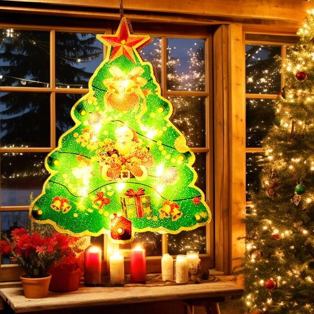 UsRHHA Christmas Window Lights, Hanging Decorative Lights with Battery Power, Festive Shop Home Decor. A green acrylic Christmas tree-shaped light featuring ornaments, gift boxes, and a glowing star topper. The light is illuminated and hangs in front of a window, creating a cozy holiday atmosphere. Ideal for windows, doors, mantels, and more. Requires 3 AAA batteries (not included).