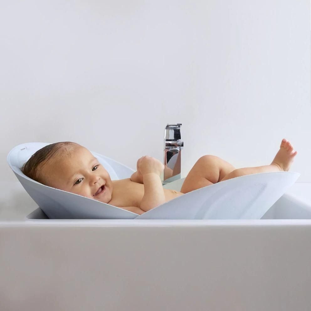 Frida Baby - Soft Sink Baby Bath - Easy To Clean Baby Bathtub + Bath Cushion That Supports Baby's Head - Quick Dry Material - Machine Washable