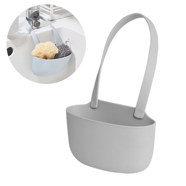 Support Suspendu pour Évier Porte-Éponge pour Évier de Cuisine en Matériau TPR durable, Montré en Couleur Gris Pâle. Conçu pour l'Organisation de la Cuisine, Il Présente un design de drain Ajouré au Bas pour Garder les Articles au Sec et Propres. Idéal pour Ranger de Petits Objets comme des Éponges et des Tampons à Récurer. Comprend une Sangle flexible pour une Suspension Facile sur les Bords de l'Évier.