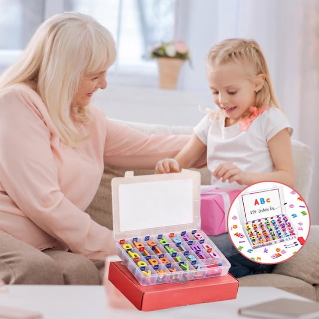xaoyunyn Interactive Magnetic Letters 104 Piece Alphabet Set with Double Sided Board displayed in a home learning setting. The set includes brightly coloured uppercase and lowercase letters made from safe EVA material with soft magnetic backing. A double-sided board is shown, suitable for spelling practice and handwriting. The letters are organized in a transparent sorting box placed on a red base, with a child and adult engaging in learning activities in the background.