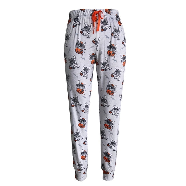 Lilo & Stitch Sleep Pant - Adults - Ladies in light grey with an all-over Halloween print of Stitch dressed as a mummy holding orange pumpkin buckets and sitting on jack-o'-lanterns, accented by small grey bats. These women's pajama pants have cuffed ankles and an orange drawstring waistband for a comfortable, relaxed fit, suitable for cozy seasonal lounging.