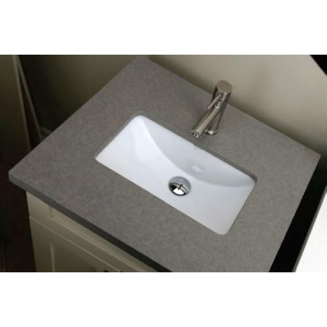 American Imaginations 16.9-in. W 11-in. D Rectangle Bathroom Undermount Sink in white ceramic with enamel glaze finish, installed under a gray countertop with a chrome single-handle faucet, designed for undermount installation and suitable for compact bathroom vanities.